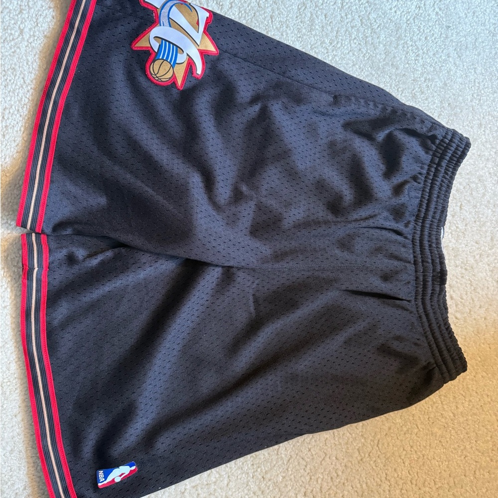 Black Mitchell and Ness men's NBA Basketball Shorts with Red Trim. Size XL.